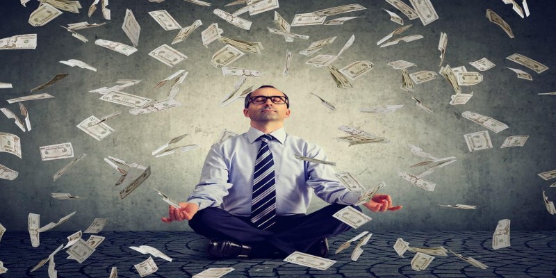 https blogs images.forbes.com joeljohnson files 2018 03 mindset of financially successful people man in yoga position with money small 1200x844 Custom